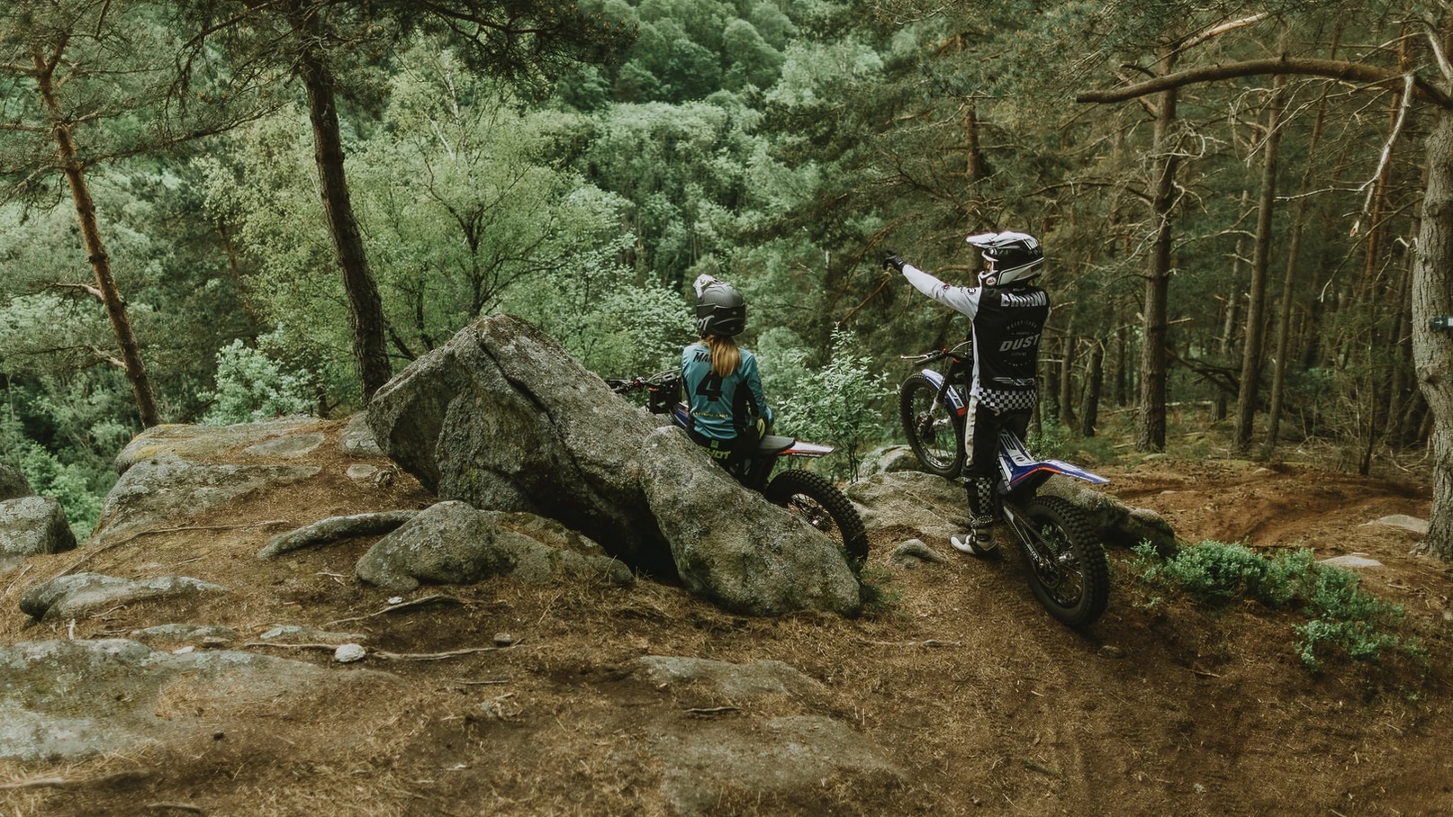 FIM E-Xplorer electric race bikes on an offroad trail. 