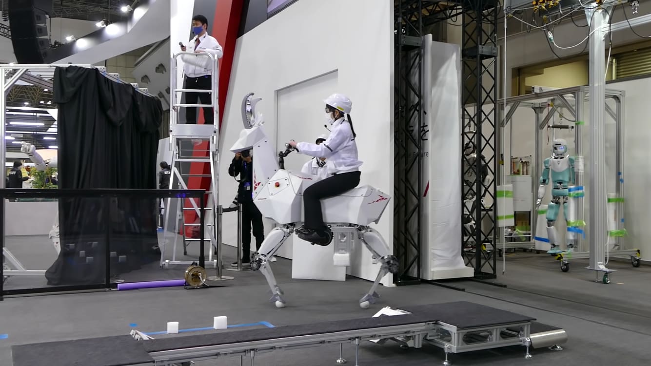 Kawasaki Bex goat robot being ridden around.