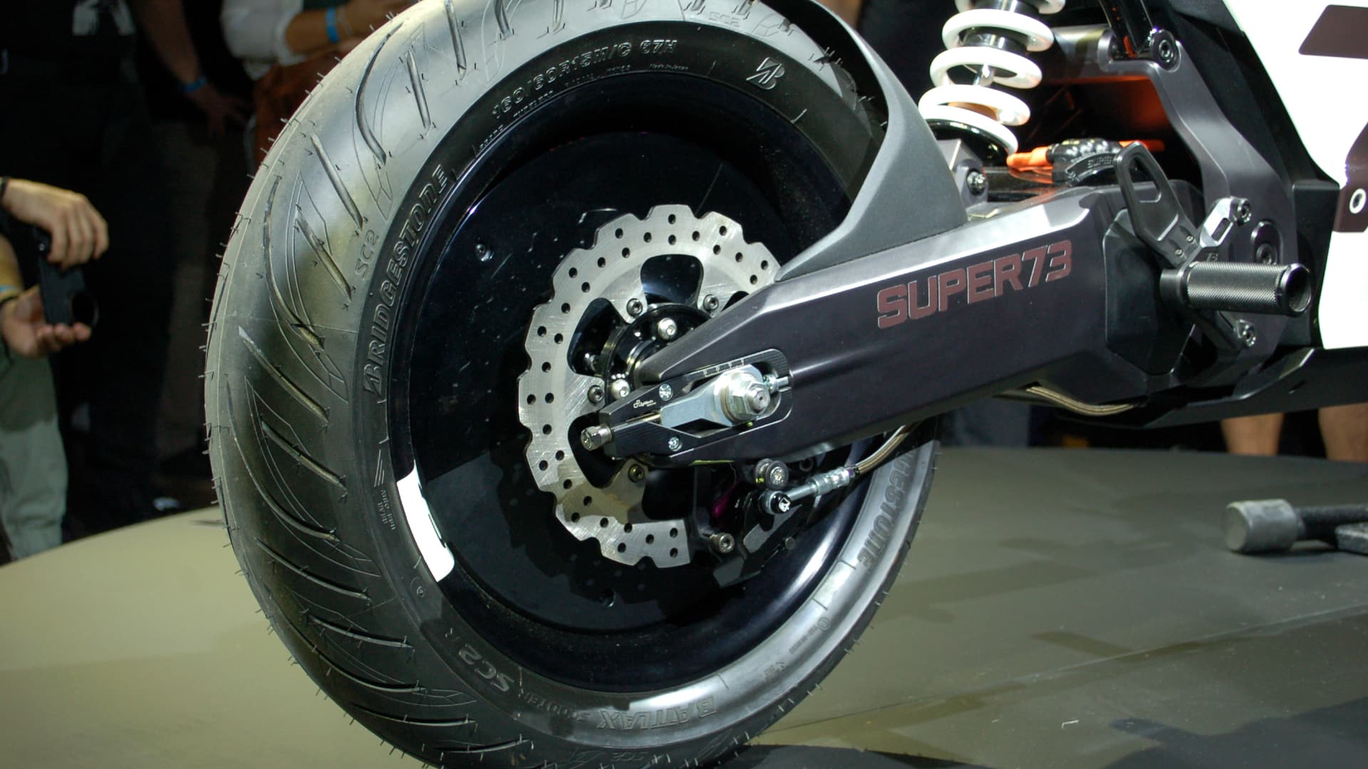 Super73 C1x concept rear wheel and swingarm on display at product reveal show. 