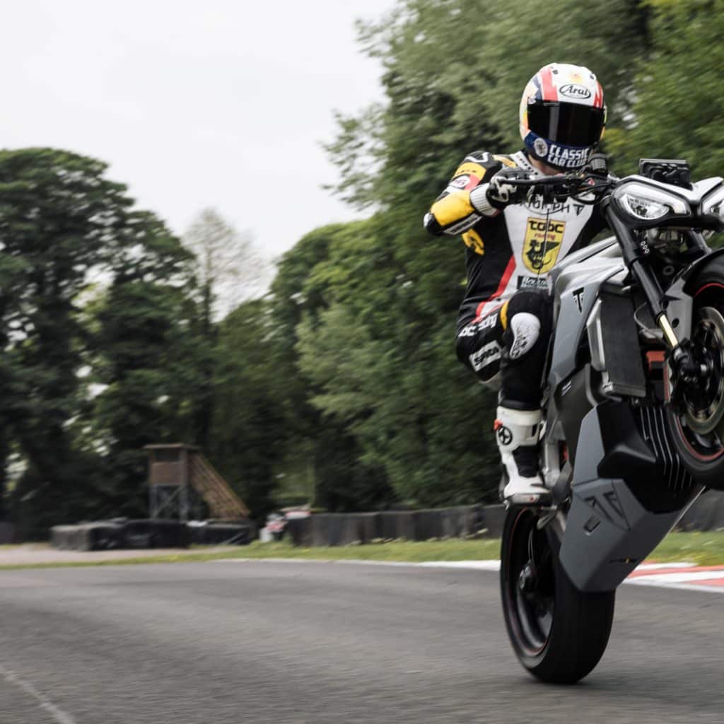 The Triumph TE1 electric motorcycle rides an awfully dank wheelie.