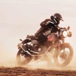 Royal Enfield Scram 411 riding in the dirt.