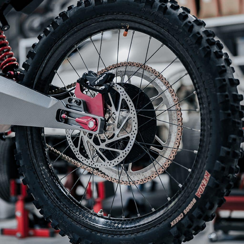 Detail of the carbon fiber wheel on the Graft eo12 dirt bike. 