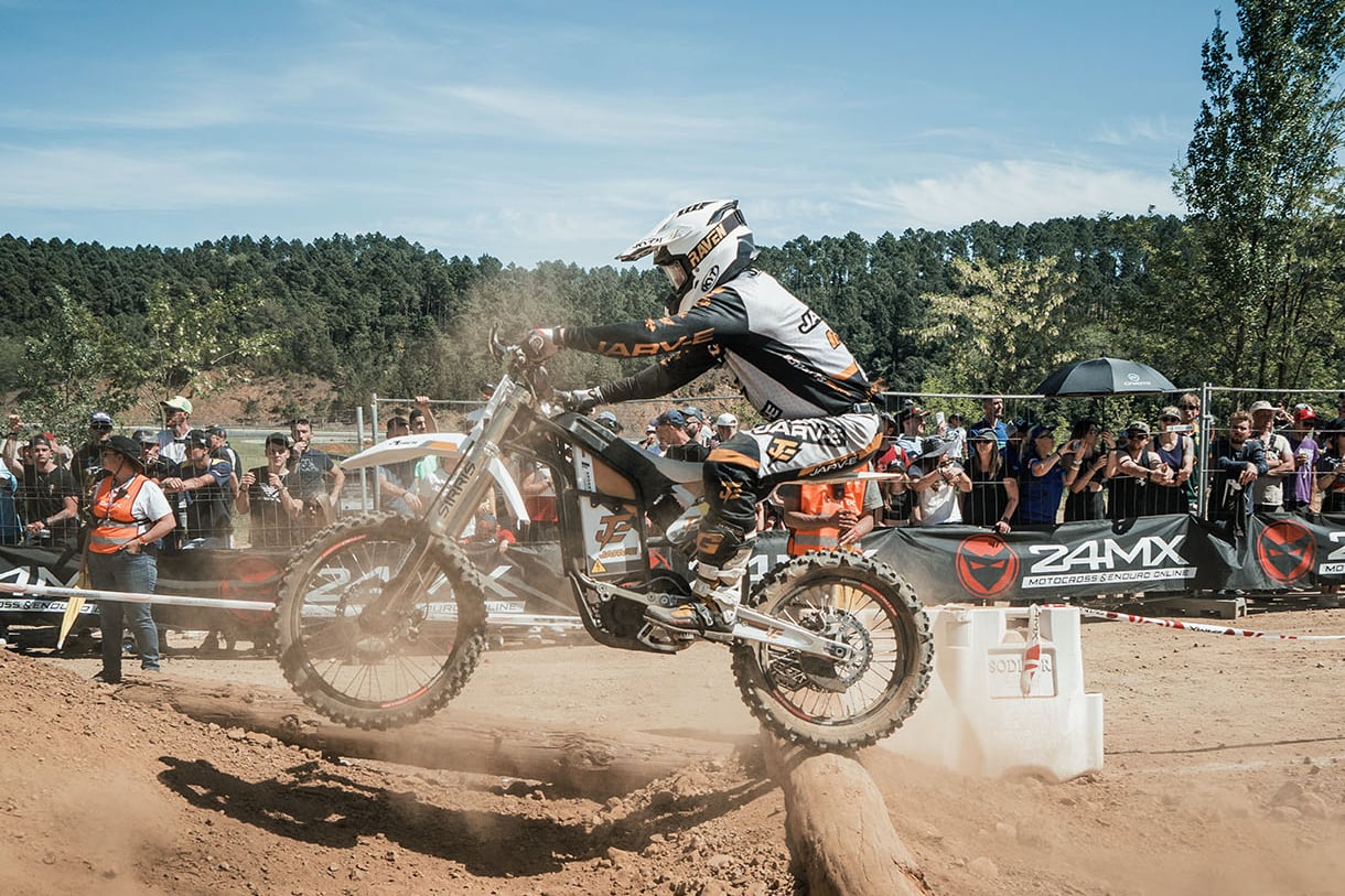 Graham Jarvis takes the Jarv-E electric enduro over an obstacles at a hard enduro event.