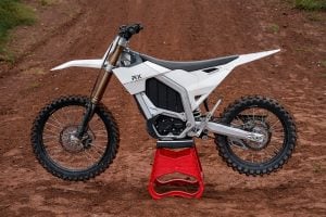 Rerode RX electric dirtbike parked in the middle of a motocross track.