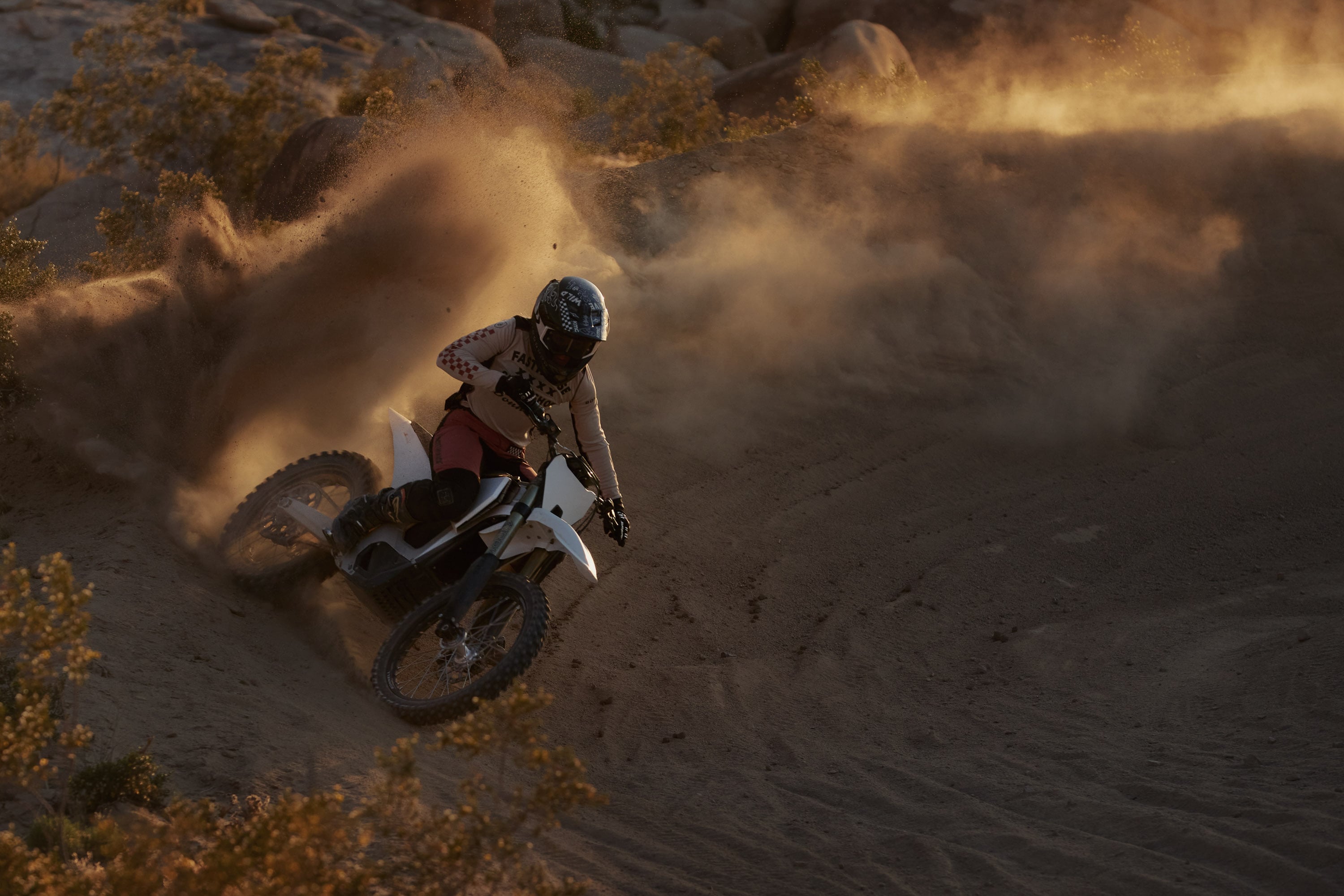 Bonnell 805 RX sliding around a sandy corner in the Mojave desert. 