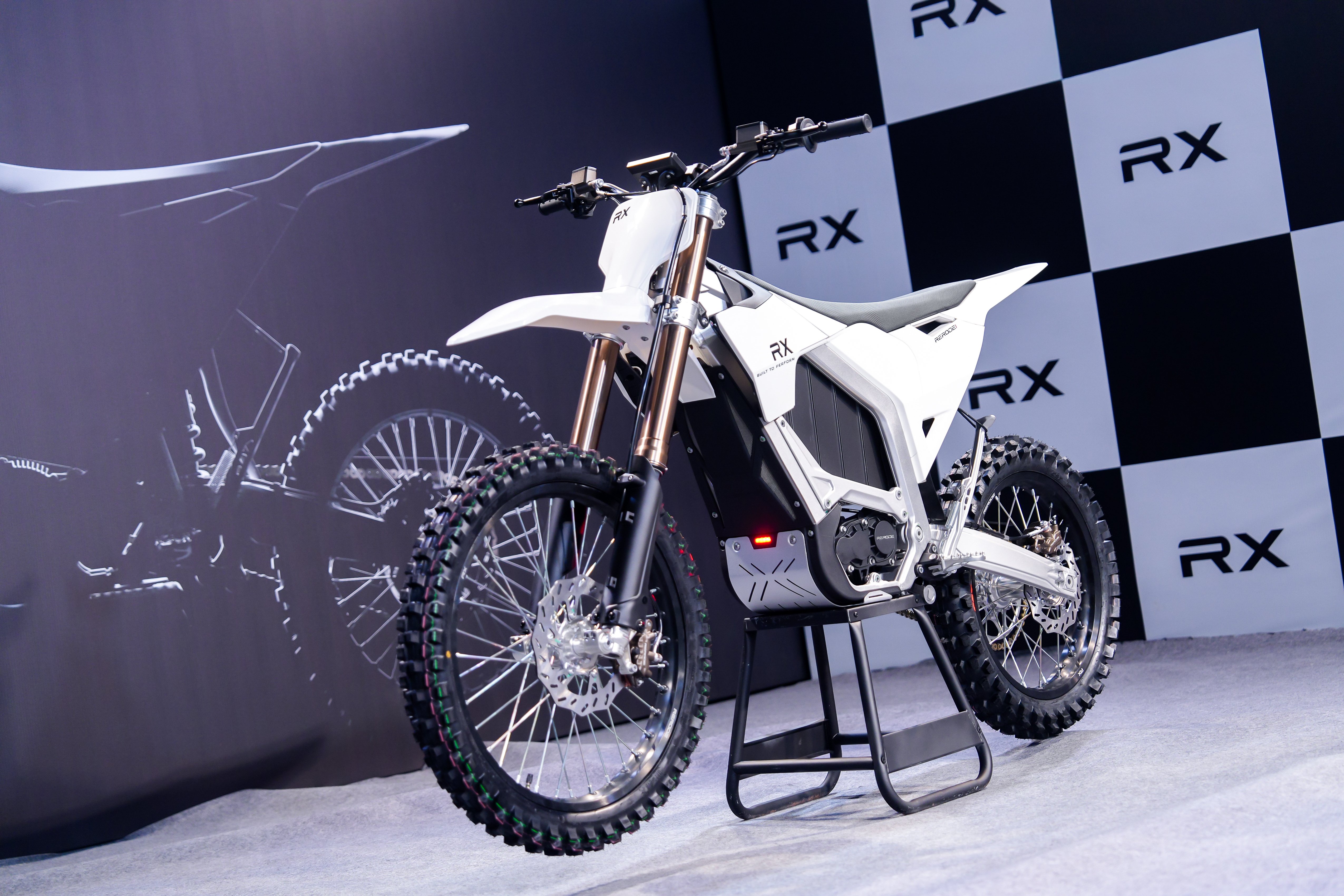 Rerode RX electric dirt bike parked inside a studio for its launch event.